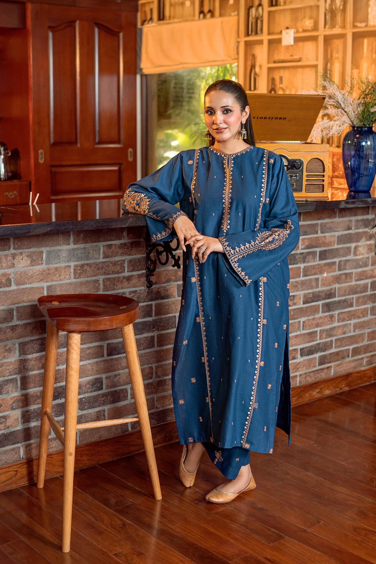 2PC Khaddar Embroidered Suitlong shirt adorned with intricate embroidery on the front and detailed embroidery on loose sleeves
