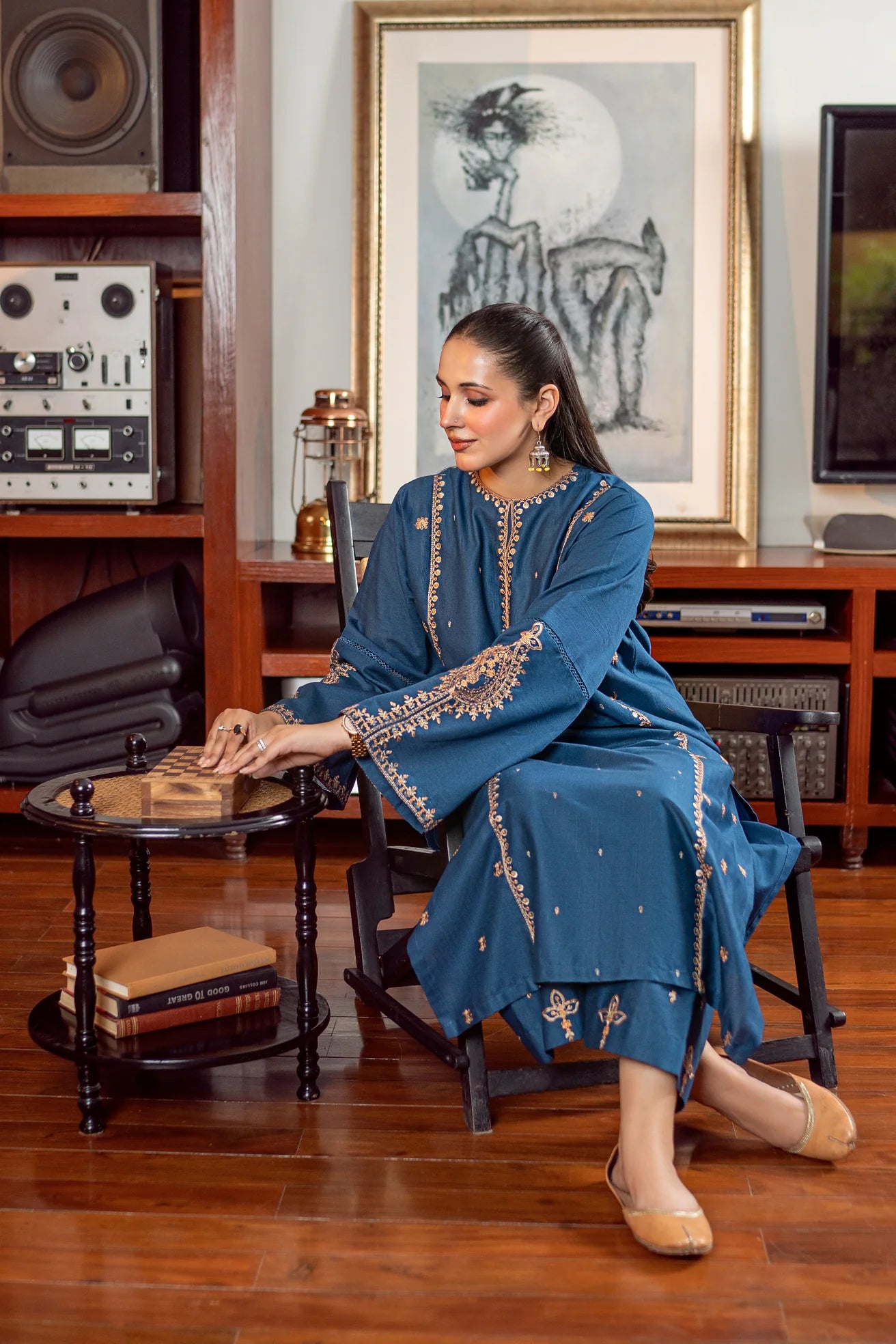 2PC Khaddar Embroidered Suitlong shirt adorned with intricate embroidery on the front and detailed embroidery on loose sleeves